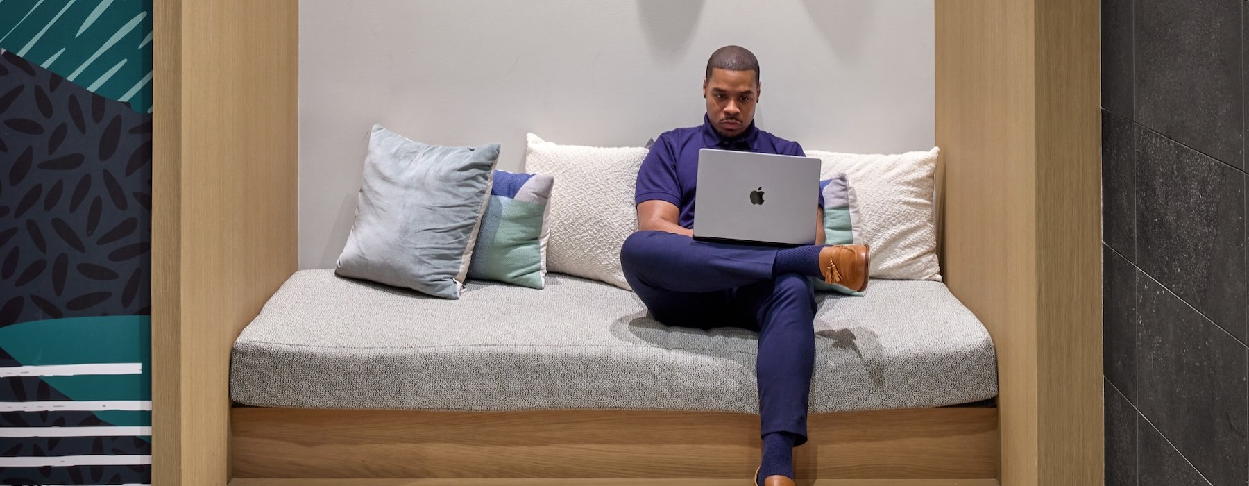 a person working on a laptop at The Oliver in Washington, DC
