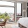 large picture windows in bedroom flooded with natural light