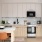 kitchen open to dining table and chairs